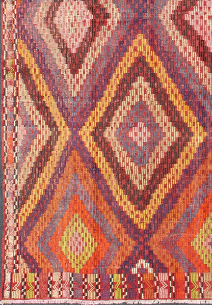 Measures: 5'7 x 10'5. Featuring a large diamond pattern with a spotted and speckled assortment of geometric checkered elements, this uniquely embroidered Kilim showcases an array saturated colors. The colors include blue, gray, red, yellow, brown, o... - Keivan Woven ArtsTU - NED - 561 - 6895Rug