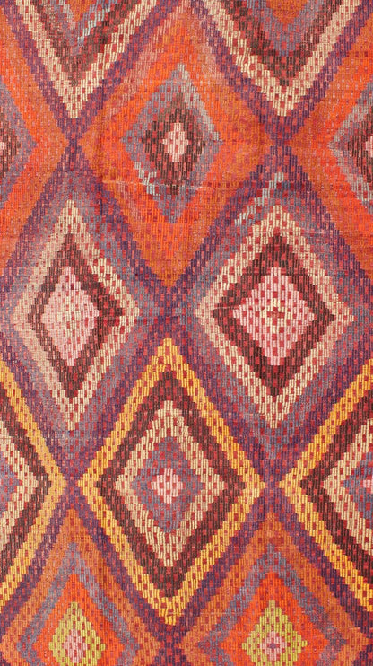 Measures: 5'7 x 10'5. Featuring a large diamond pattern with a spotted and speckled assortment of geometric checkered elements, this uniquely embroidered Kilim showcases an array saturated colors. The colors include blue, gray, red, yellow, brown, o... - Keivan Woven ArtsTU - NED - 561 - 6895Rug