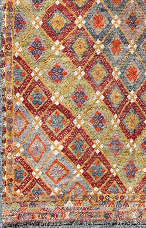 Colorful Kilim/Jijim with Diamonds - Featuring tribal shapes with a spotted and speckled assortment of geometric elements, this unique Mid - Century Jajeem showcases an array of rich colorful tones that have been softened by age. Colors include crimson red... - Keivan Woven ArtsTU - NED - 578 - 6911Rug