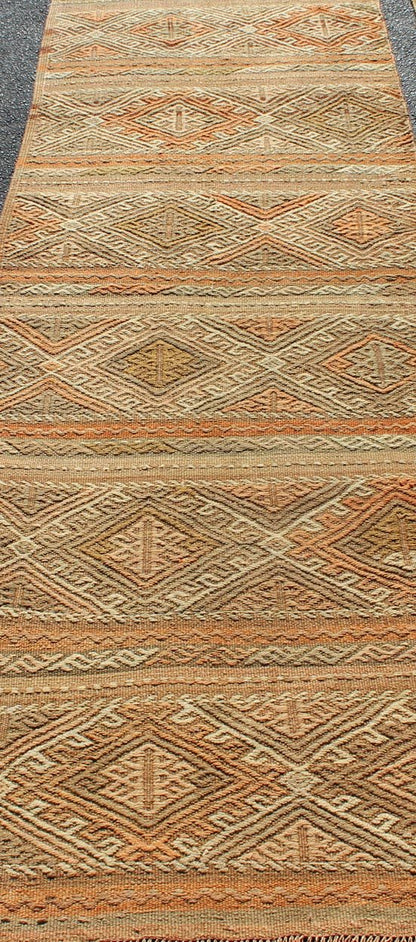 Turkish Kilim vintage carpet in taupe, tan, orange, Keivan Woven Arts / rug TU - NED - 621, country of origin / type: Turkey / Kilim, circa 1950 This Kilim rug from Turkey features a striped design of various geometric patterns rendered in shades of... - Keivan Woven ArtsTU - NED - 621 - 12487Rug