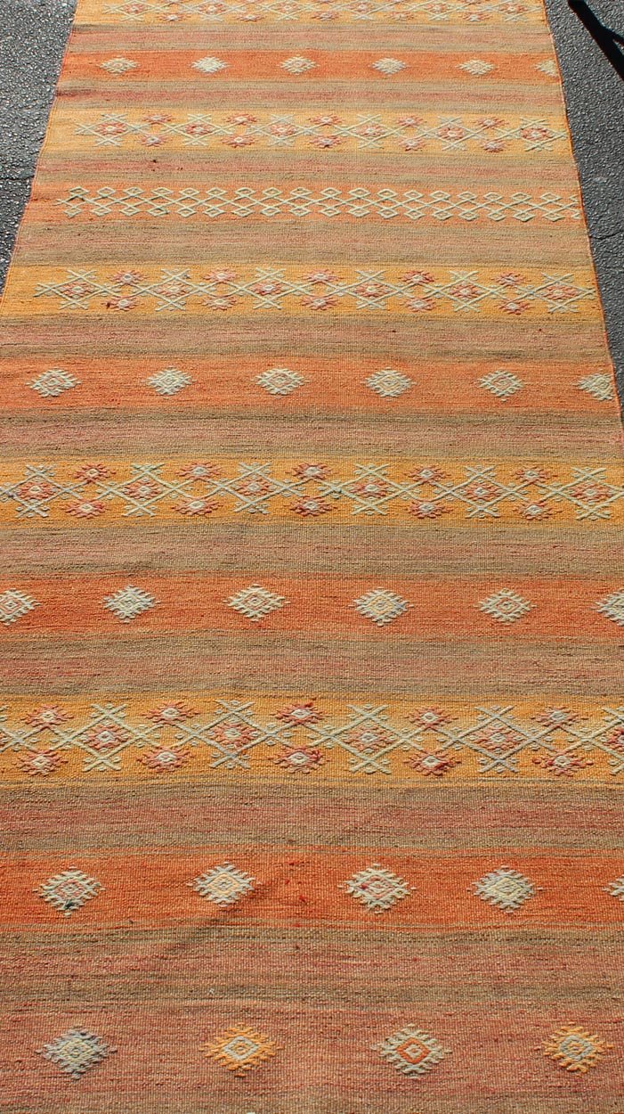 Colorful Vintage Turkish Kilim Rug with Horizontal Stripes and Geometric Shapes Vintage Turkish Kilim runner with horizontal stripes and scattered geometric shapes, rug TU - NED - 631, country of origin / type: Turkey / Kilim, circa mid - 20th century... - Keivan Woven ArtsTU - NED - 631 - 12509Rug