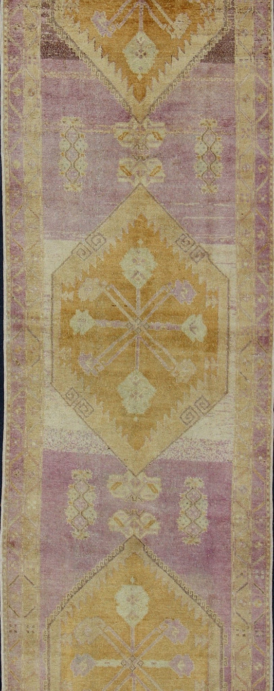 Purple and gold - toned Antique Oushak Runner from Turkey with Medallion Design, rug tu - sim - 03, country of origin / type: Turkey / Oushak, circa 1920 This beautiful vintage Oushak runner from 1920s Turkey features a Classic Oushak design, which is... - Keivan Woven ArtsTU - SIM - 03 - 2418Rug
