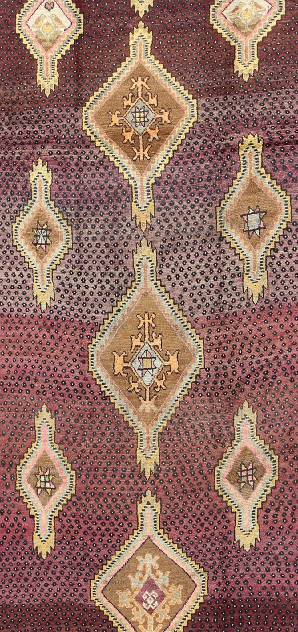 Vintage Turkish Medallion Oushak Kars Gallery Runner in Gold and Burgundy Measures: 5'7 x 12'8 This unique Turkish gallery runner rests beautifully upon a field of elegant purple and eggplant colors. The field medallions are decorated wi... - Keivan Woven ArtsTU - SIM - 136501 - 5026Rug