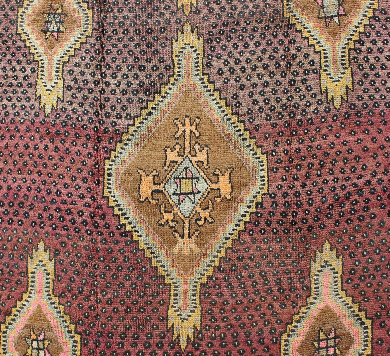 Vintage Turkish Medallion Oushak Kars Gallery Runner in Gold and Burgundy Measures: 5'7 x 12'8 This unique Turkish gallery runner rests beautifully upon a field of elegant purple and eggplant colors. The field medallions are decorated wi... - Keivan Woven ArtsTU - SIM - 136501 - 5026Rug