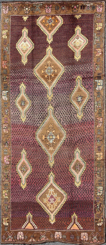 Vintage Turkish Medallion Oushak Kars Gallery Runner in Gold and Burgundy Measures: 5'7 x 12'8 This unique Turkish gallery runner rests beautifully upon a field of elegant purple and eggplant colors. The field medallions are decorated wi... - Keivan Woven ArtsTU - SIM - 136501 - 5026Rug
