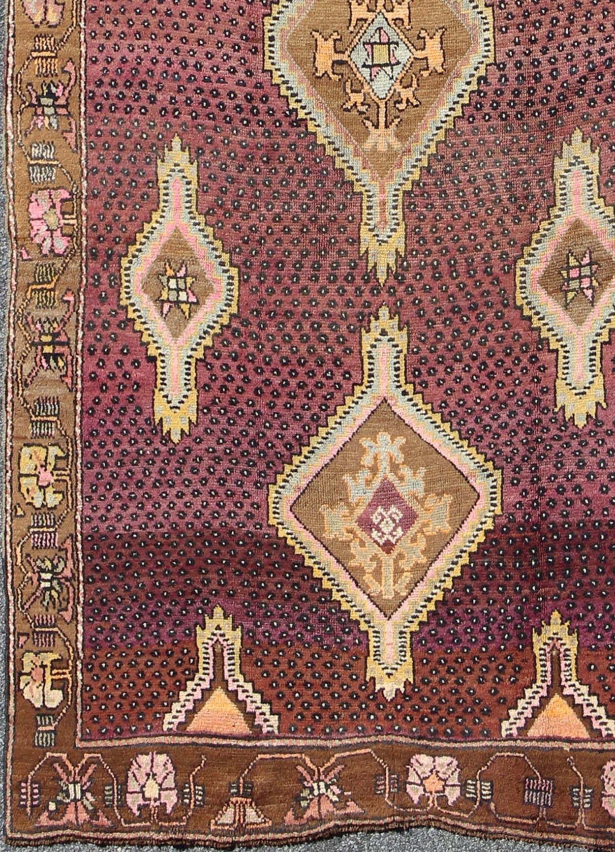 Vintage Turkish Medallion Oushak Kars Gallery Runner in Gold and Burgundy Measures: 5'7 x 12'8 This unique Turkish gallery runner rests beautifully upon a field of elegant purple and eggplant colors. The field medallions are decorated wi... - Keivan Woven ArtsTU - SIM - 136501 - 5026Rug