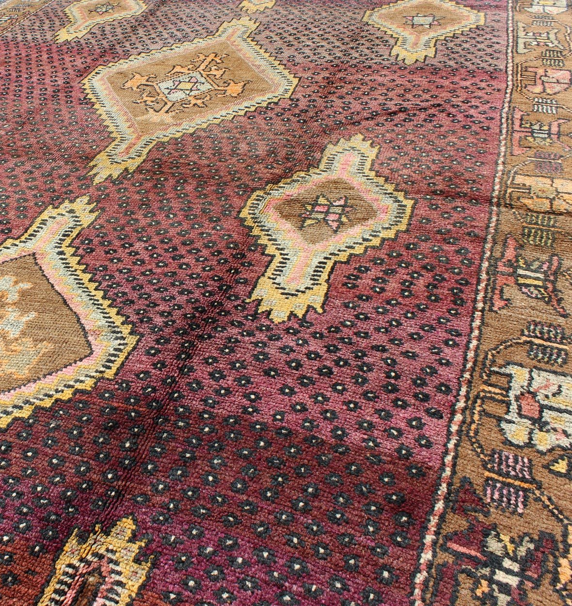 Vintage Turkish Medallion Oushak Kars Gallery Runner in Gold and Burgundy Measures: 5'7 x 12'8 This unique Turkish gallery runner rests beautifully upon a field of elegant purple and eggplant colors. The field medallions are decorated wi... - Keivan Woven ArtsTU - SIM - 136501 - 5026Rug
