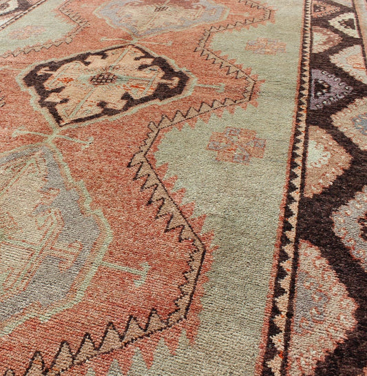 Turkish Oushak Rug This soft color Oushak carpet rests beautifully upon a field of elegant green and tangerine. Three medallions take center stage and are well balanced with a border of cast green, orange and natural brown. This Oushak remains e... - Keivan Woven ArtsTU - TOZ - 136540 - 5032Rug