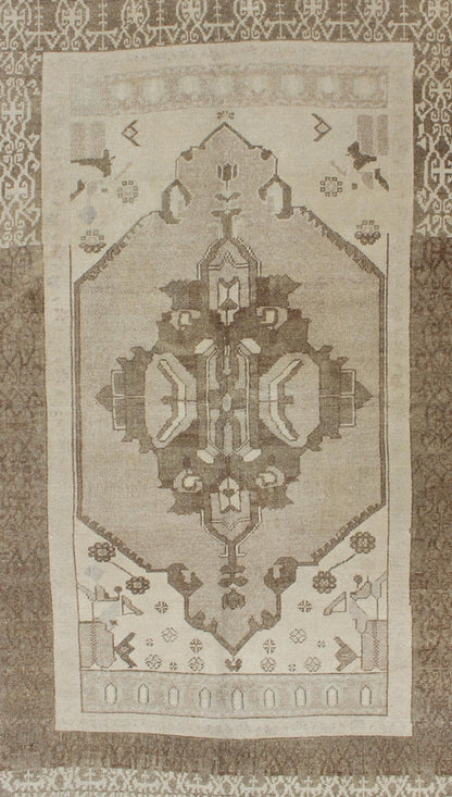 This Vintage Turkish Oushak is set on a taupe background. The geometric medallion features light green and brown with accents of darker brown. The border is very modern with unique motifs, while the overall feel of the piece is muted and contemporary. ... - Keivan Woven ArtsTU - TRS - 112964 - 3594Rug