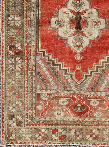 This antique Oushak bears a stylized medallion that commands the center field. A broad border of repeating motifs and floral patterns enclose the entire rug. Coral and light green colors complement the light brown, sub - geometric border. Turkish... - Keivan Woven ArtsTU - TRS - 136037 - 5048Rug