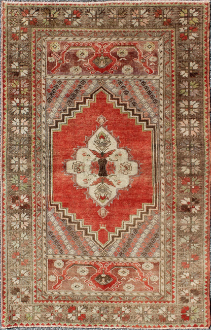 This antique Oushak bears a stylized medallion that commands the center field. A broad border of repeating motifs and floral patterns enclose the entire rug. Coral and light green colors complement the light brown, sub - geometric border. Turkish... - Keivan Woven ArtsTU - TRS - 136037 - 5048Rug
