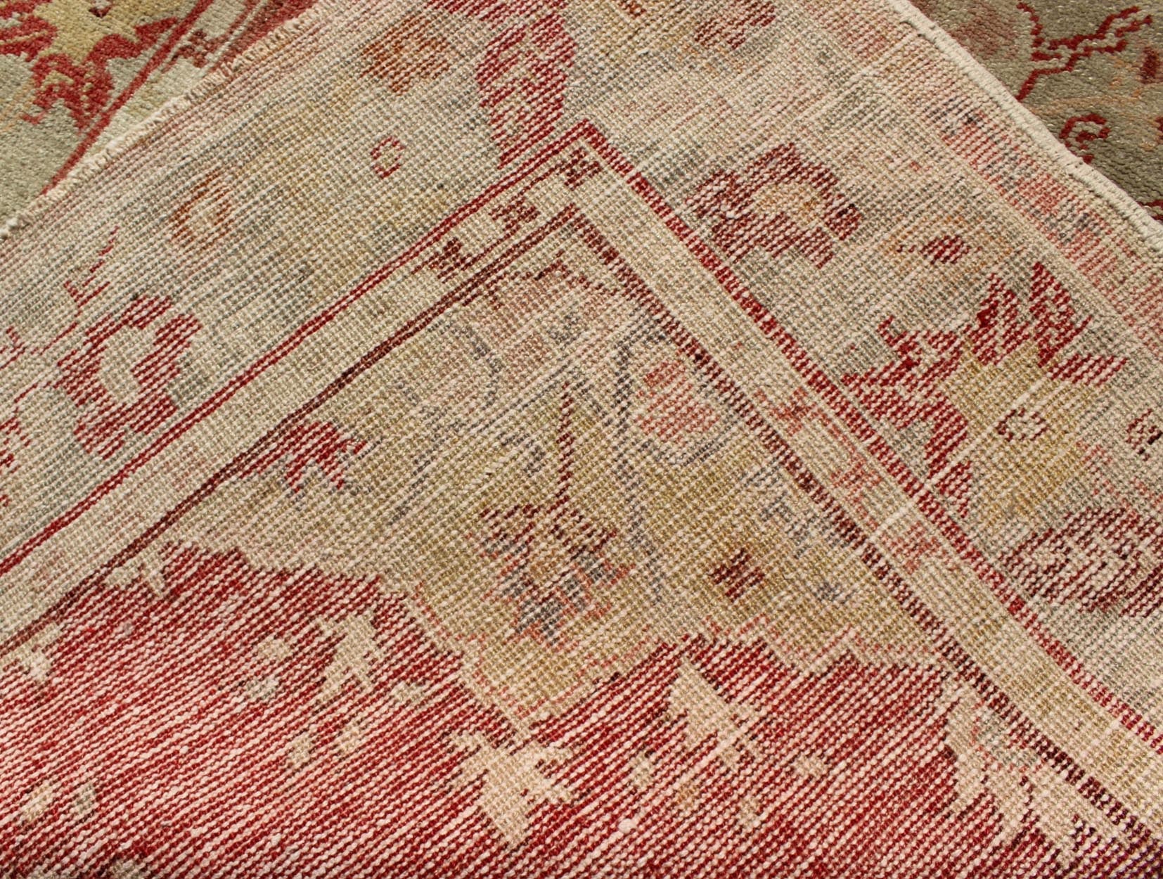 Measures: 3'5 x 5'6 Red Field Vintage Turkish Oushak Rug with Geometric Medallion And Floral Motifs. Keivan Woven Arts / rug TU - TRS - 136045, country of origin / type: Turkey / Oushak, circa 1940. This vintage Turkish Oushak rug (circa mid - ... - Keivan Woven ArtsTU - TRS - 136045 - 5060Rug