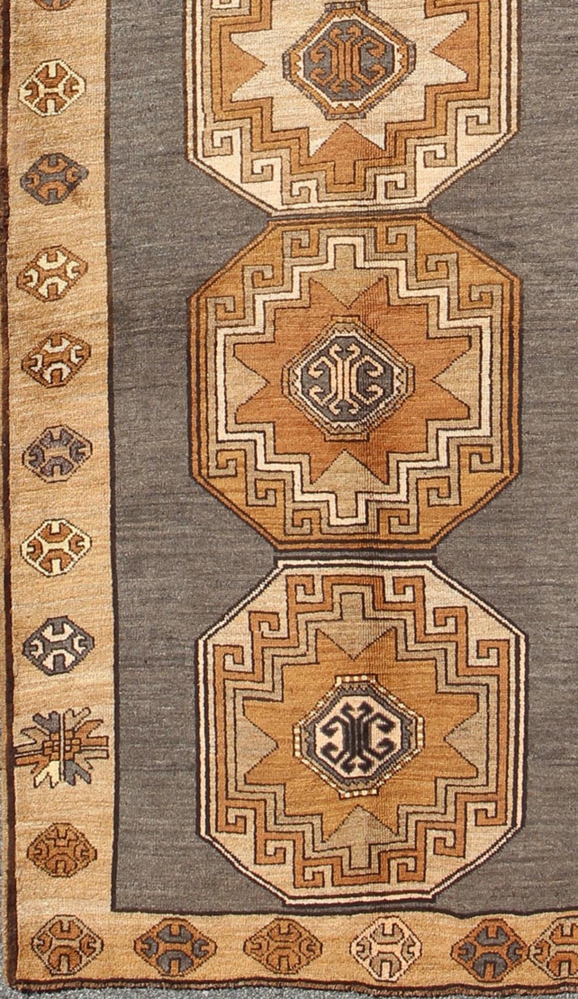 Shades of brown vintage Turkish Oushak runner with vertical medallion design, rug tu - TRS - 136085, country of origin / type: Turkey / Oushak, circa 1940 This vintage Turkish Oushak gallery rug, (circa mid - 20th century) features a unique blend of c... - Keivan Woven ArtsTU - TRS - 136085 - 5070Rug