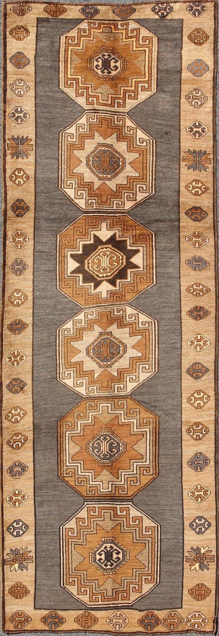 Shades of brown vintage Turkish Oushak runner with vertical medallion design, rug tu - TRS - 136085, country of origin / type: Turkey / Oushak, circa 1940 This vintage Turkish Oushak gallery rug, (circa mid - 20th century) features a unique blend of c... - Keivan Woven ArtsTU - TRS - 136085 - 5070Rug