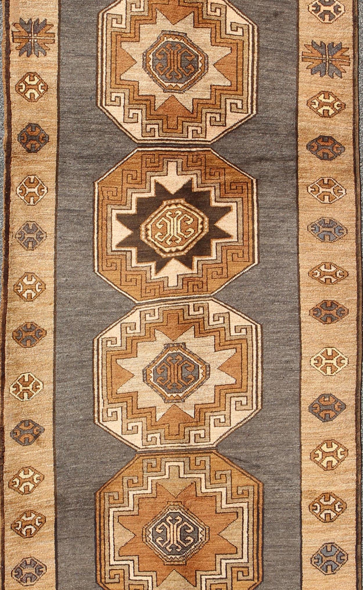 Shades of brown vintage Turkish Oushak runner with vertical medallion design, rug tu - TRS - 136085, country of origin / type: Turkey / Oushak, circa 1940 This vintage Turkish Oushak gallery rug, (circa mid - 20th century) features a unique blend of c... - Keivan Woven ArtsTU - TRS - 136085 - 5070Rug