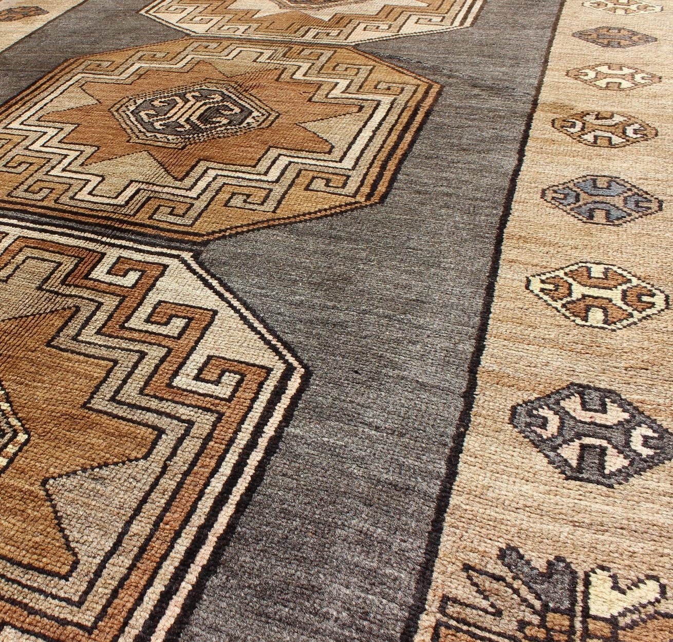 Shades of brown vintage Turkish Oushak runner with vertical medallion design, rug tu - TRS - 136085, country of origin / type: Turkey / Oushak, circa 1940 This vintage Turkish Oushak gallery rug, (circa mid - 20th century) features a unique blend of c... - Keivan Woven ArtsTU - TRS - 136085 - 5070Rug