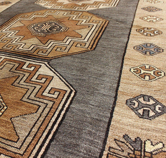 Shades of brown vintage Turkish Oushak runner with vertical medallion design, rug tu - TRS - 136085, country of origin / type: Turkey / Oushak, circa 1940 This vintage Turkish Oushak gallery rug, (circa mid - 20th century) features a unique blend of c... - Keivan Woven ArtsTU - TRS - 136085 - 5070Rug
