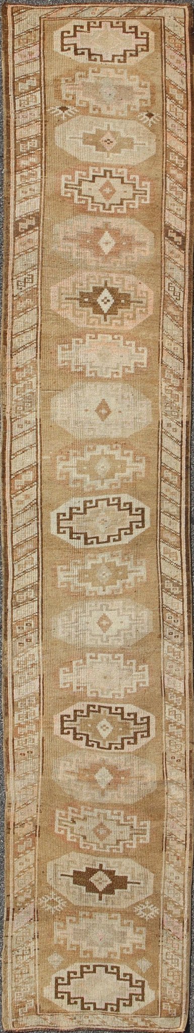 Long vintage Turkish runner with taupe, cream, brown stacked medallions, rug tu - trs - 136522, country of origin / type: Turkey / Oushak, circa 1930 This long vintage Turkish gallery rug (circa 1930) features a unique blend of colors and an intrica... - Keivan Woven ArtsTU - TRS - 136522 - 5112Rug