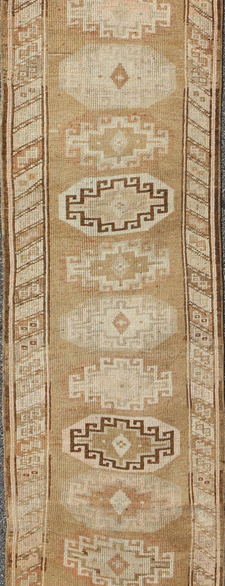 Long vintage Turkish runner with taupe, cream, brown stacked medallions, rug tu - trs - 136522, country of origin / type: Turkey / Oushak, circa 1930 This long vintage Turkish gallery rug (circa 1930) features a unique blend of colors and an intrica... - Keivan Woven ArtsTU - TRS - 136522 - 5112Rug