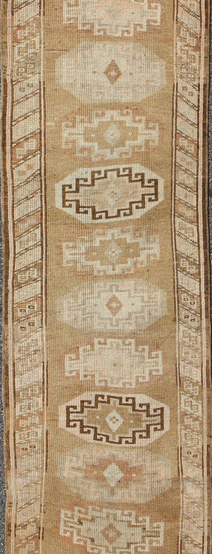 Long vintage Turkish runner with taupe, cream, brown stacked medallions, rug tu - trs - 136522, country of origin / type: Turkey / Oushak, circa 1930 This long vintage Turkish gallery rug (circa 1930) features a unique blend of colors and an intrica... - Keivan Woven ArtsTU - TRS - 136522 - 5112Rug