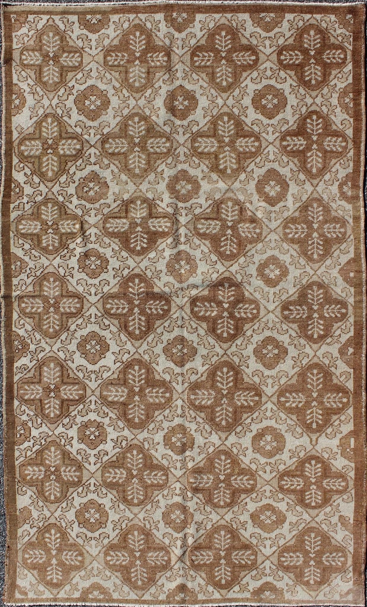 All - Over Blossom and Palmette Design Vintage Turkish Oushak Rug in Brown Tones Measures: 4'4 x 7'7. This Oushak carpet (circa mid - 20th century) features an all - over pattern of interconnected, vertically - arranged blossom and palmette motif... - Keivan Woven ArtsTU - TRS - 3254 - 6201Rug