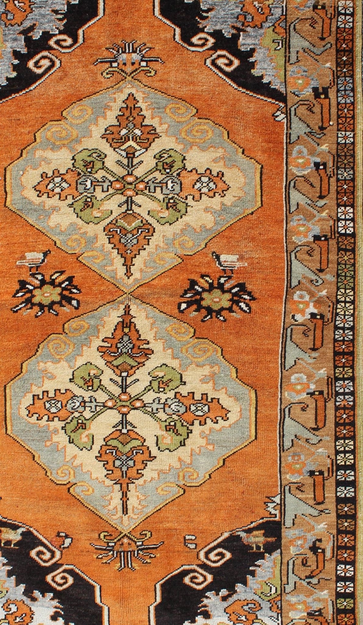 Vintage Turkish Tribal Medallion Area Rug in Orange, Green, Brown, and Blue Measures: 3'9 x 6'5 This vibrantly colored Turkish Oushak features two medallions and a highly detailed design set on an orange background with dark brown and lig... - Keivan Woven ArtsTU - TRS - 3259 - 5848Rug