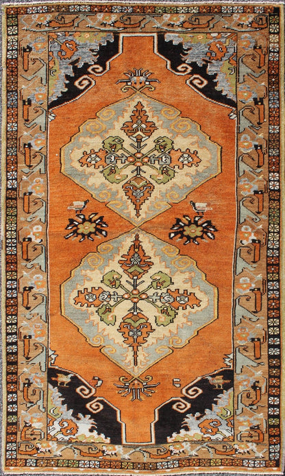 Vintage Turkish Tribal Medallion Area Rug in Orange, Green, Brown, and Blue Measures: 3'9 x 6'5 This vibrantly colored Turkish Oushak features two medallions and a highly detailed design set on an orange background with dark brown and lig... - Keivan Woven ArtsTU - TRS - 3259 - 5848Rug