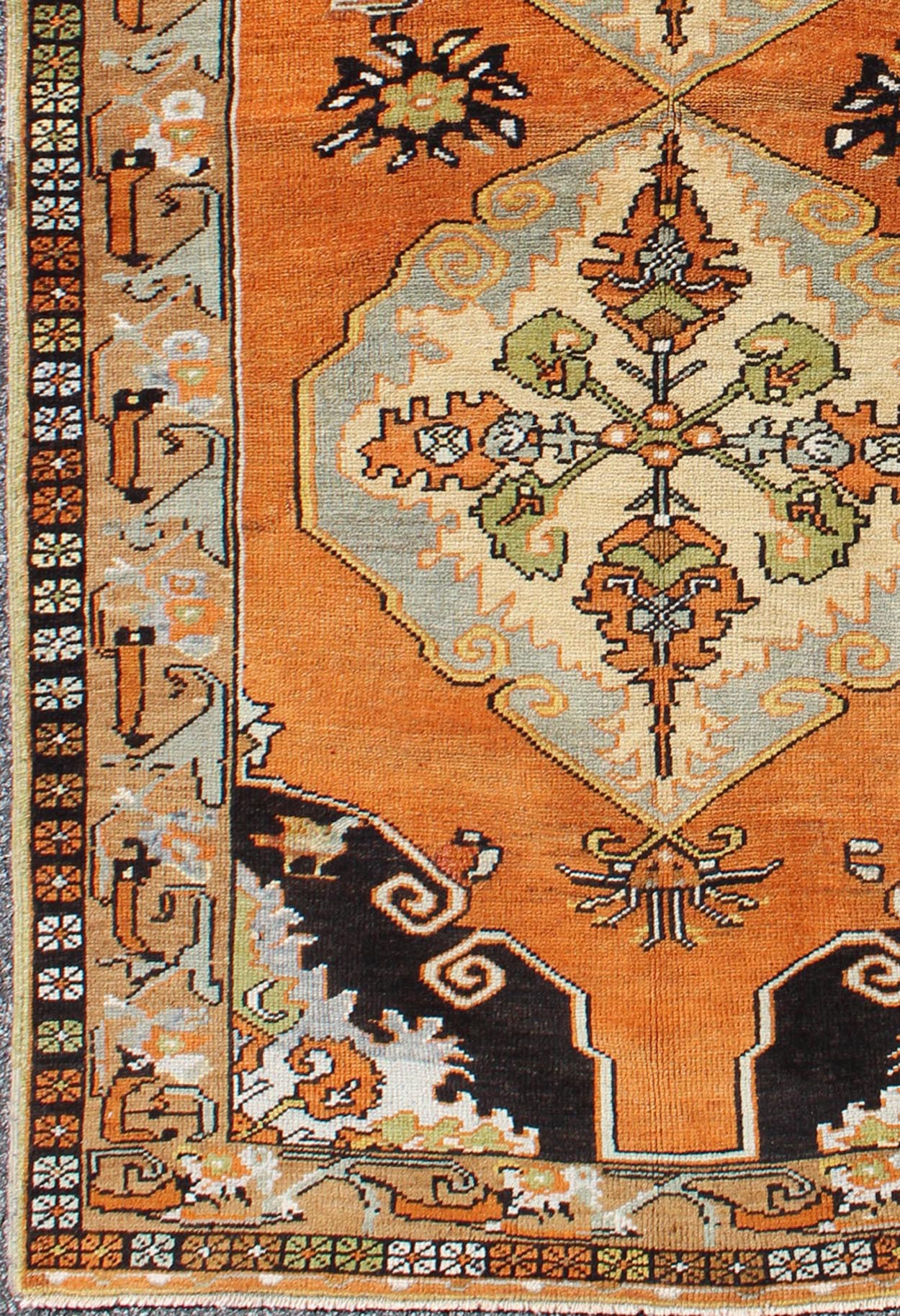 Vintage Turkish Tribal Medallion Area Rug in Orange, Green, Brown, and Blue Measures: 3'9 x 6'5 This vibrantly colored Turkish Oushak features two medallions and a highly detailed design set on an orange background with dark brown and lig... - Keivan Woven ArtsTU - TRS - 3259 - 5848Rug