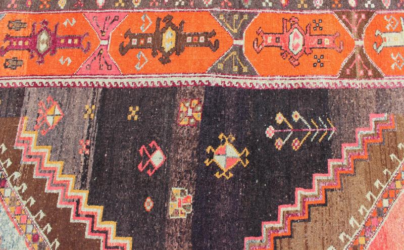 Large Gallery Rug with Geometric Medallions in Dark Brown, Orange & Multi Colors. Vintage wide and long gallery runner from Turkey with geometric layered Medallion design in Brown background and various tones of orange, coral, salmon, pink, ligh... - Keivan Woven ArtsTU - TRS - 3260 - 6418Rug