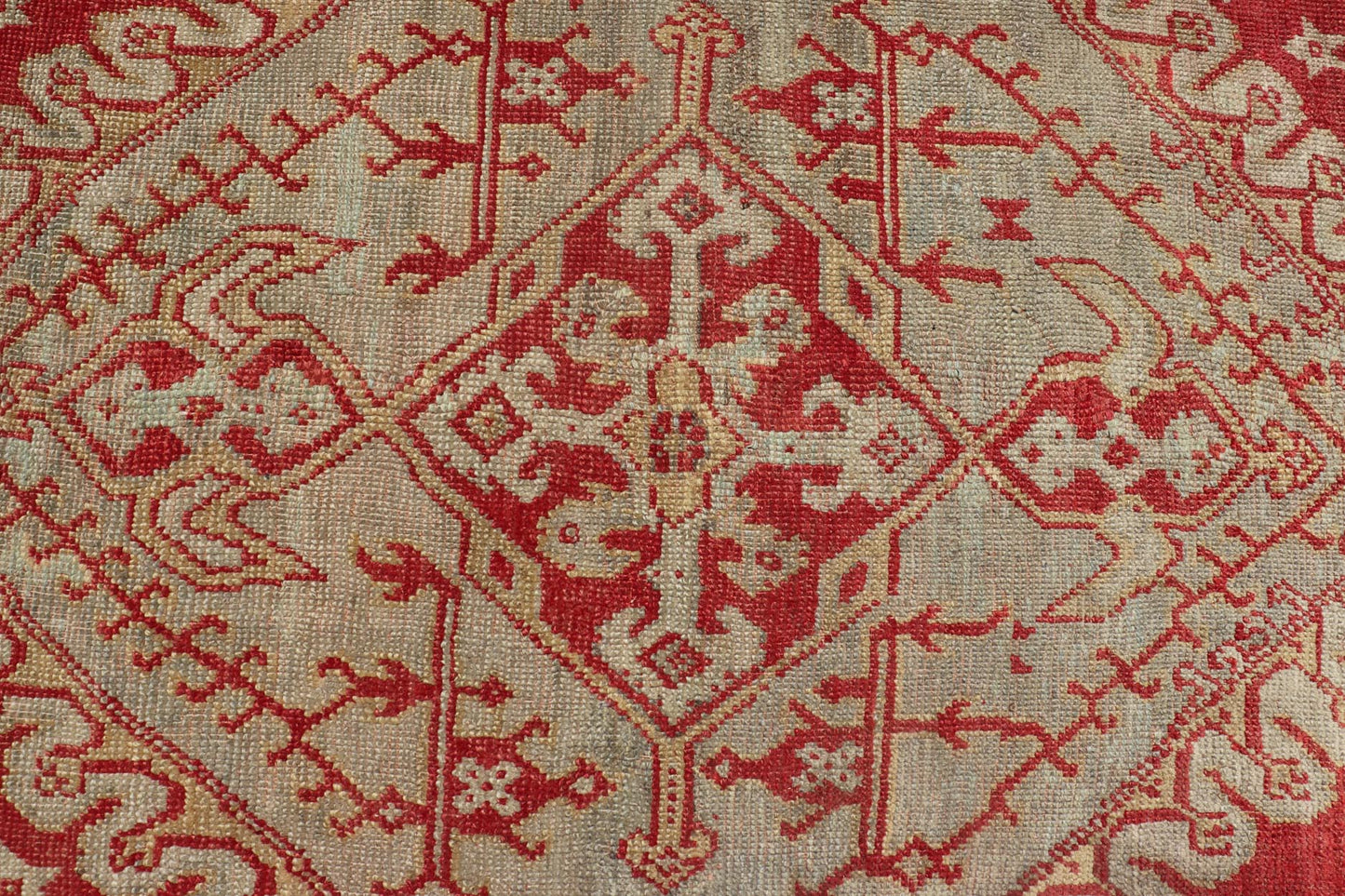 Antique Turkish Oushak rug in delicate red background and light blue border, Rug / TU - TRS - 3472, Antique Oushak Circa 1910 This lovely antique Oushak showcases an elegant medallion design with four cornices that hold the field. The background... - Keivan Woven ArtsTU - TRS - 3472 - 6919Rug
