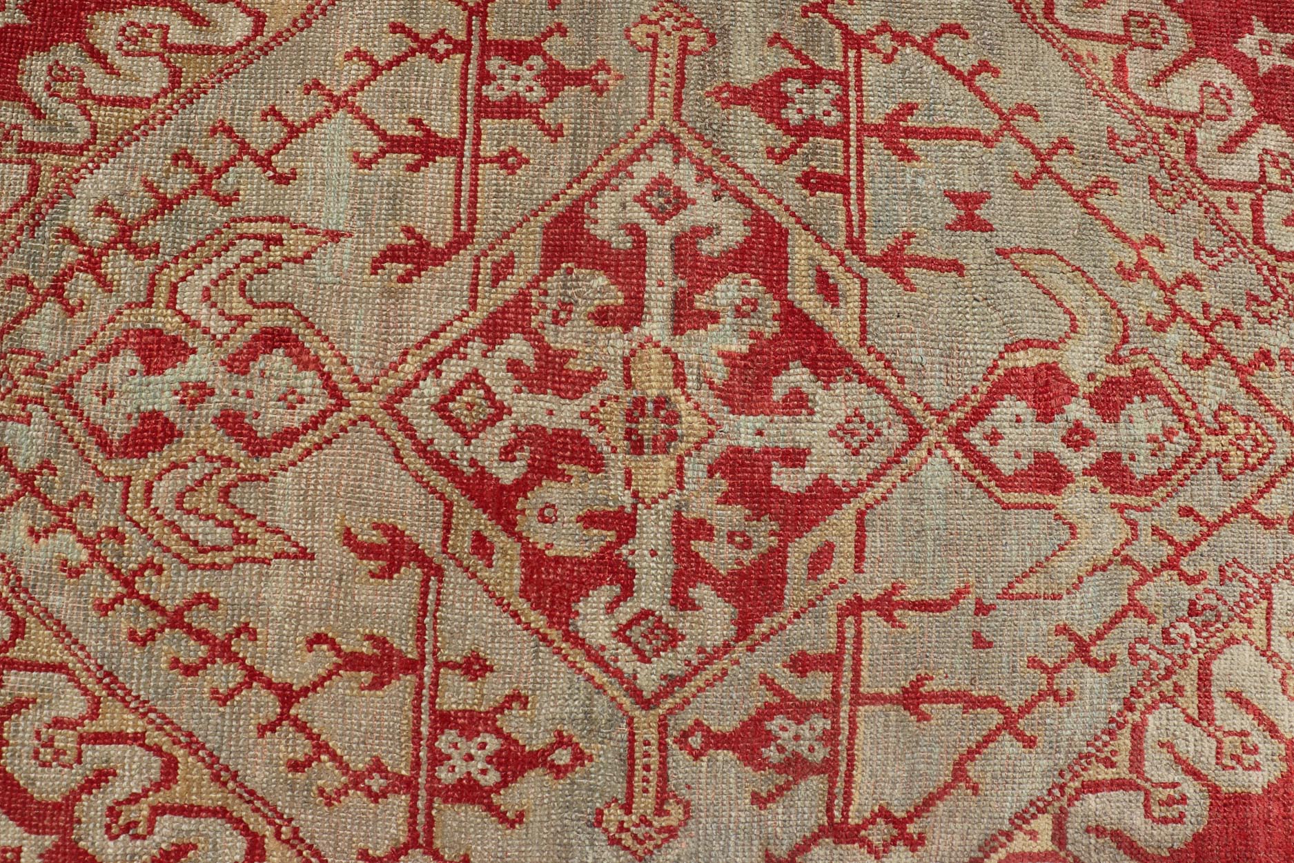 Antique Turkish Oushak rug in delicate red background and light blue border, Rug / TU - TRS - 3472, Antique Oushak Circa 1910 This lovely antique Oushak showcases an elegant medallion design with four cornices that hold the field. The background... - Keivan Woven ArtsTU - TRS - 3472 - 6919Rug