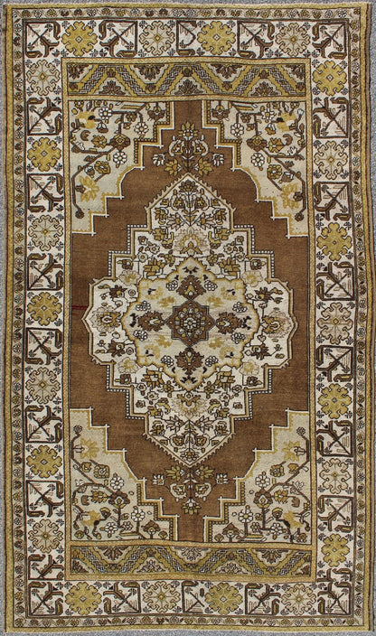 Mocha brown, chartreuse vintage Turkish Oushak rug with ornate floral medallion, Keivan Woven Arts / rug tu - TRS - 3473, country of origin / type: Turkey / Oushak, circa 1940. Measures: 6'4 x 9'11. This vintage, mid century Turkish Oushak ru... - Keivan Woven ArtsTU - TRS - 3473 - 6925Rug