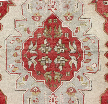 Layered medallion antique Turkish Oushak rug with red sub - geometric motifs Measures: 4'4 x 7'9 This vintage Turkish Oushak rug features an intricate geometric medallion design. The central medallion is surrounded by multi - layers in the fi... - Keivan Woven ArtsTU - TRS - 3600 - 7245Rug