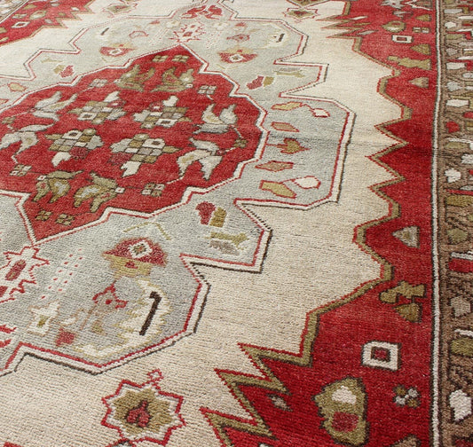 Layered medallion antique Turkish Oushak rug with red sub - geometric motifs Measures: 4'4 x 7'9 This vintage Turkish Oushak rug features an intricate geometric medallion design. The central medallion is surrounded by multi - layers in the fi... - Keivan Woven ArtsTU - TRS - 3600 - 7245Rug