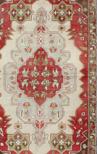 Layered medallion antique Turkish Oushak rug with red sub - geometric motifs Measures: 4'4 x 7'9 This vintage Turkish Oushak rug features an intricate geometric medallion design. The central medallion is surrounded by multi - layers in the fi... - Keivan Woven ArtsTU - TRS - 3600 - 7245Rug