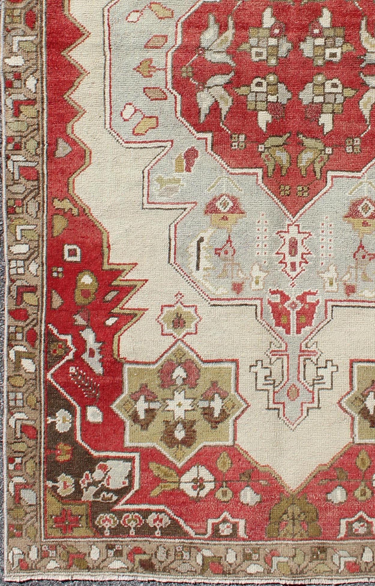 Layered medallion antique Turkish Oushak rug with red sub - geometric motifs Measures: 4'4 x 7'9 This vintage Turkish Oushak rug features an intricate geometric medallion design. The central medallion is surrounded by multi - layers in the fi... - Keivan Woven ArtsTU - TRS - 3600 - 7245Rug