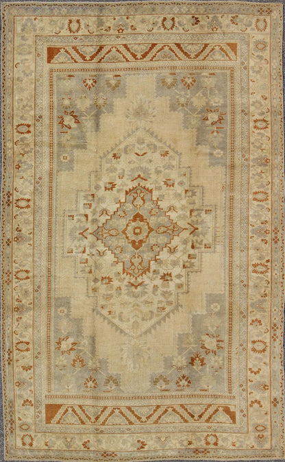 Floral Layered Medallion Vintage Turkish Oushak Rug in Cream, Ivory, Gray & Brown Measures: 6'10'' x 11'3''. This Oushak carpet (circa mid - 20th century) features a multi - layered medallion framed in the central field. Complementary floral desi... - Keivan Woven ArtsTU - TRS - 3619 - 7255Rug
