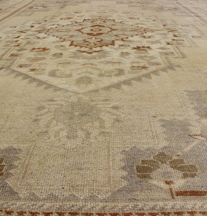 Floral Layered Medallion Vintage Turkish Oushak Rug in Cream, Ivory, Gray & Brown Measures: 6'10'' x 11'3''. This Oushak carpet (circa mid - 20th century) features a multi - layered medallion framed in the central field. Complementary floral desi... - Keivan Woven ArtsTU - TRS - 3619 - 7255Rug