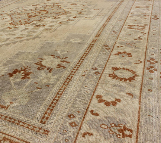 Floral Layered Medallion Vintage Turkish Oushak Rug in Cream, Ivory, Gray & Brown Measures: 6'10'' x 11'3''. This Oushak carpet (circa mid - 20th century) features a multi - layered medallion framed in the central field. Complementary floral desi... - Keivan Woven ArtsTU - TRS - 3619 - 7255Rug