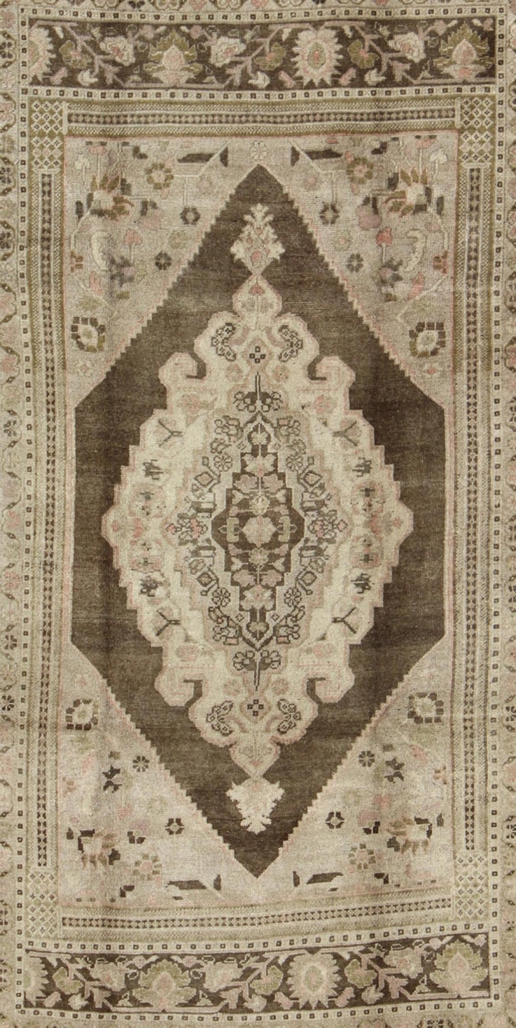 Measures: 6.1 x 9.8 Set on a muddy green background, this vintage Turkish Oushak displays a rustic diamond medallion decorated with vines and flora. The darker border homes similar stylizations of floral motifs commonly seen with Oushaks from th... - Keivan Woven ArtsTU - TRS - 95003 - 3880Rug