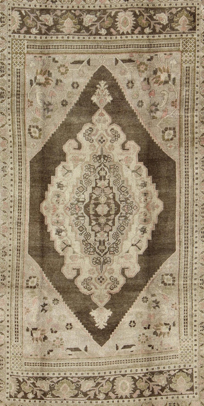 Measures: 6.1 x 9.8 Set on a muddy green background, this vintage Turkish Oushak displays a rustic diamond medallion decorated with vines and flora. The darker border homes similar stylizations of floral motifs commonly seen with Oushaks from th... - Keivan Woven ArtsTU - TRS - 95003 - 3880Rug