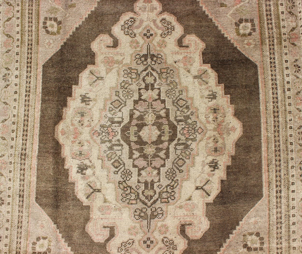 Measures: 6.1 x 9.8 Set on a muddy green background, this vintage Turkish Oushak displays a rustic diamond medallion decorated with vines and flora. The darker border homes similar stylizations of floral motifs commonly seen with Oushaks from th... - Keivan Woven ArtsTU - TRS - 95003 - 3880Rug