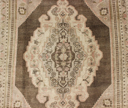 Measures: 6.1 x 9.8 Set on a muddy green background, this vintage Turkish Oushak displays a rustic diamond medallion decorated with vines and flora. The darker border homes similar stylizations of floral motifs commonly seen with Oushaks from th... - Keivan Woven ArtsTU - TRS - 95003 - 3880Rug