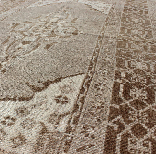 Vintage Turkish Medallion Oushak Area Rug in Grey and Brown's Measures: 3.10 x 6.10 Set amidst a taupe and gray background and featuring a gentle medallion, the beautiful and delicate design of this rug is framed by repeating geometric el... - Keivan Woven ArtsTU - TRS - 95020 - 3582Rug