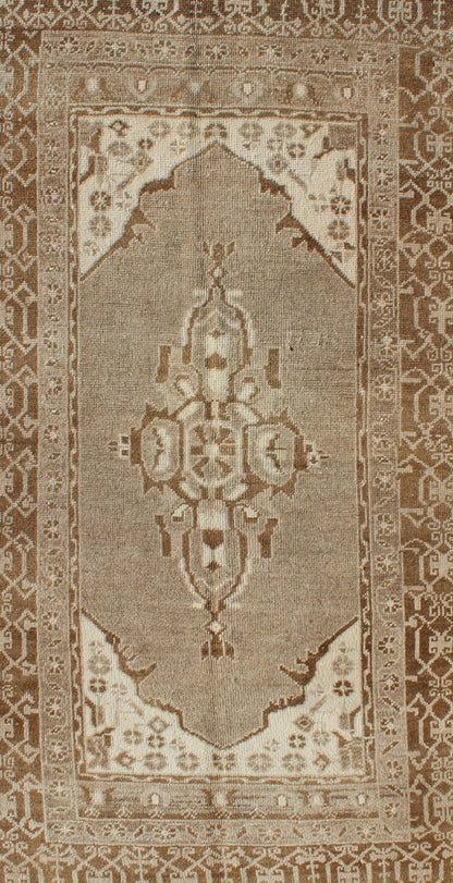 Vintage Turkish Medallion Oushak Area Rug in Grey and Brown's Measures: 3.10 x 6.10 Set amidst a taupe and gray background and featuring a gentle medallion, the beautiful and delicate design of this rug is framed by repeating geometric el... - Keivan Woven ArtsTU - TRS - 95020 - 3582Rug