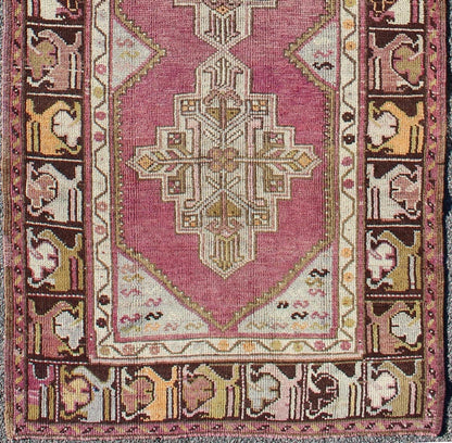 Vintage Oushak Runner This unusual Oushak bears a remarkable geometric design that is complemented by a delicately understated color palette. The purple background plays host to an intriguing display of muted geometric patterns in hues of pale a... - Keivan Woven ArtsTU - TRS - 95151 - 5040Rug