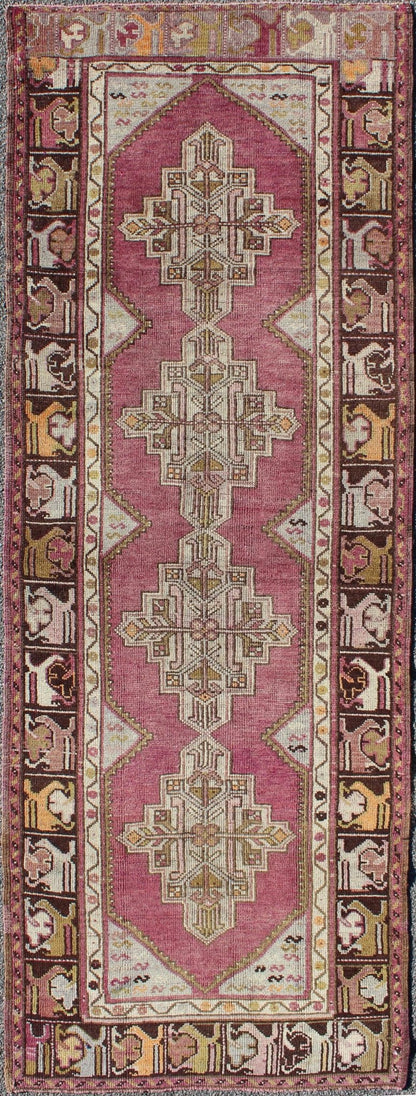 Vintage Oushak Runner This unusual Oushak bears a remarkable geometric design that is complemented by a delicately understated color palette. The purple background plays host to an intriguing display of muted geometric patterns in hues of pale a... - Keivan Woven ArtsTU - TRS - 95151 - 5040Rug