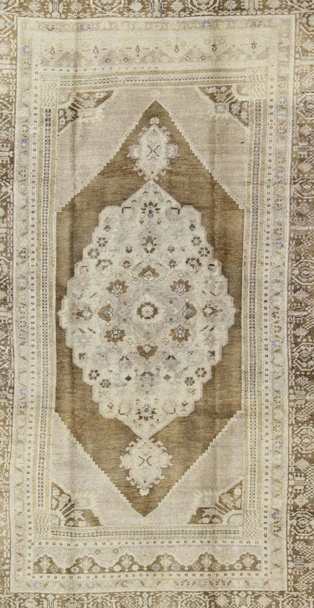 Vintage Turkish Floral Medallion Oushak Rug in Khaki and Brown Tones Measures: 5'11 x 9'6 Set on a khaki background and brown border, this vintage Turkish Oushak displays an unique earth tone color combination with various shades of taupe... - Keivan Woven ArtsTU - UGU - 11 - 3126Rug