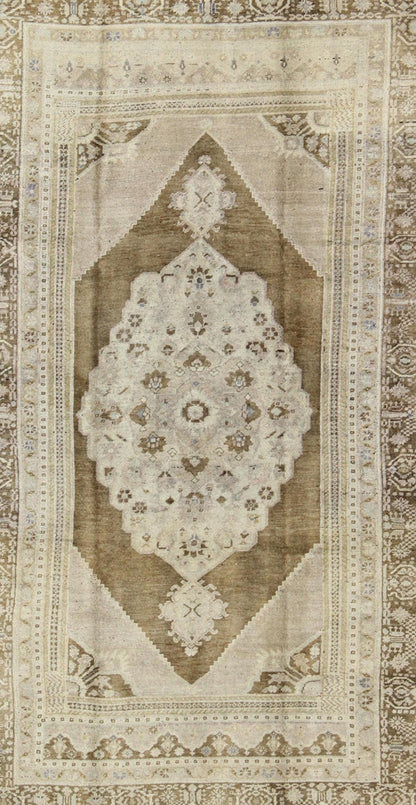 Vintage Turkish Floral Medallion Oushak Rug in Khaki and Brown Tones Measures: 5'11 x 9'6 Set on a khaki background and brown border, this vintage Turkish Oushak displays an unique earth tone color combination with various shades of taupe... - Keivan Woven ArtsTU - UGU - 11 - 3126Rug