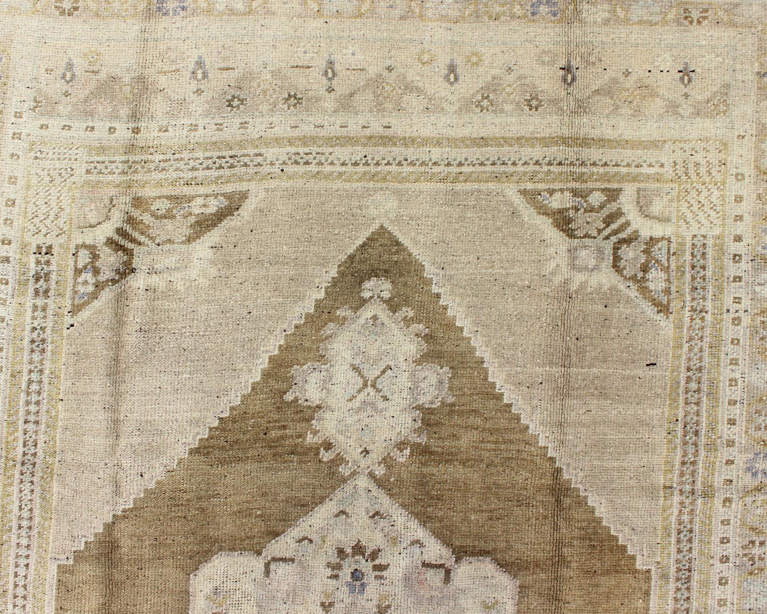 Vintage Turkish Floral Medallion Oushak Rug in Khaki and Brown Tones Measures: 5'11 x 9'6 Set on a khaki background and brown border, this vintage Turkish Oushak displays an unique earth tone color combination with various shades of taupe... - Keivan Woven ArtsTU - UGU - 11 - 3126Rug